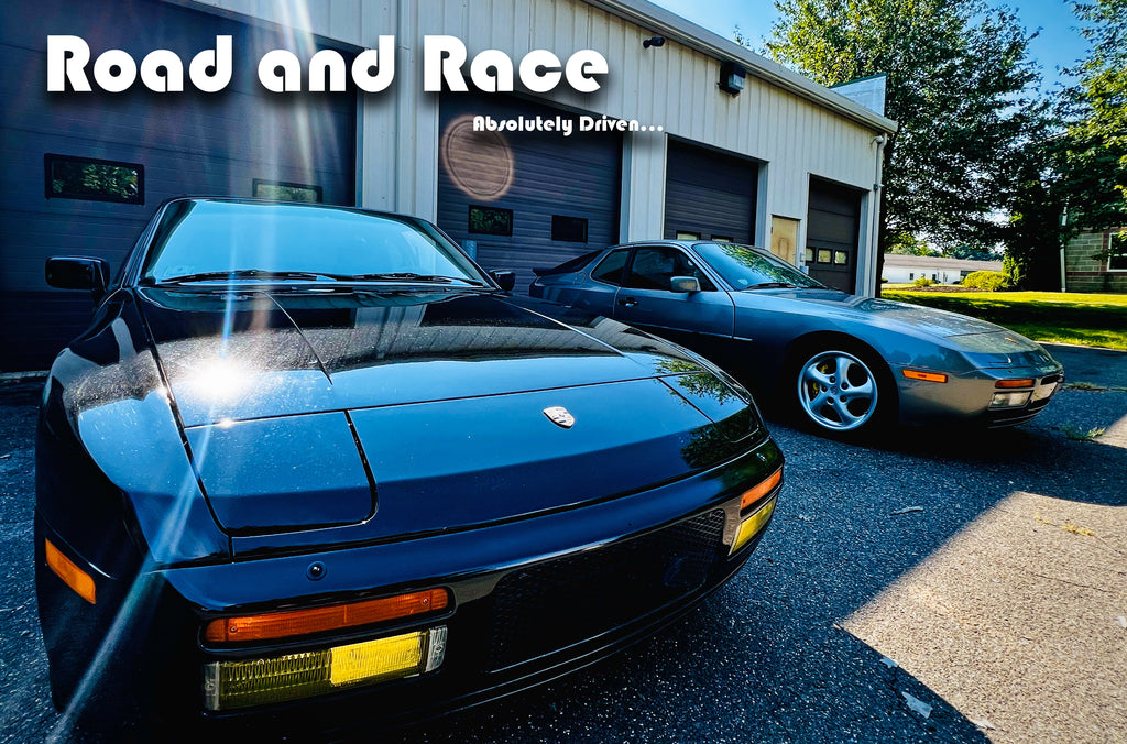 A Porsche 944 Turbo road car parked next to a Porsche 944 Turbo racecar